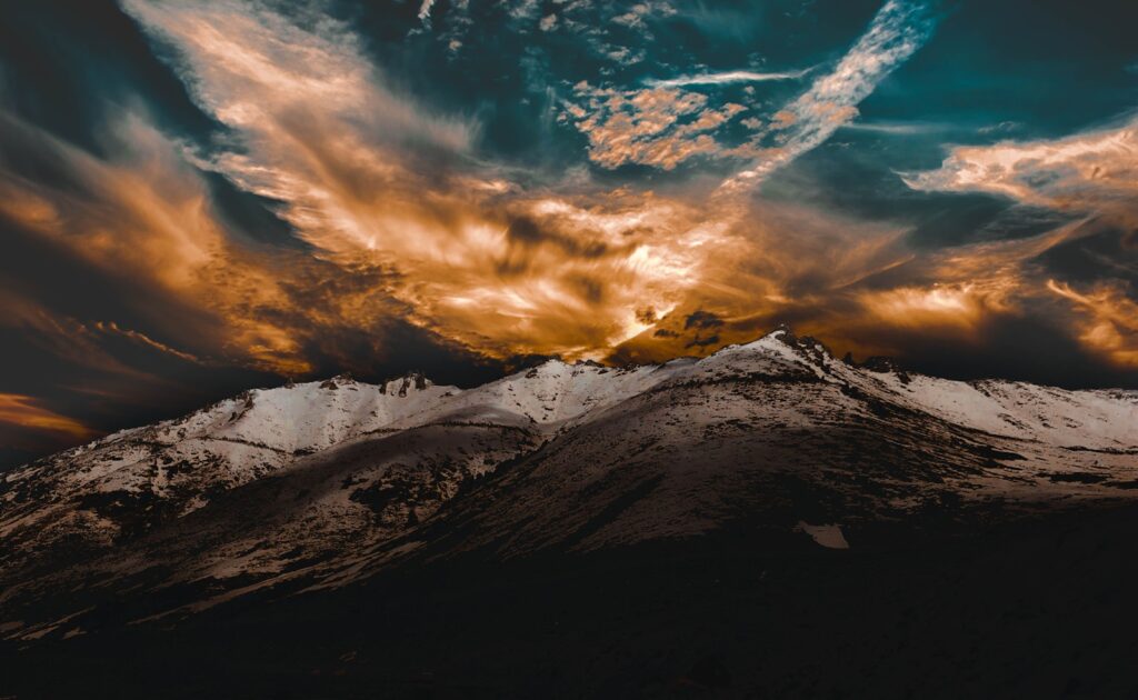 snow covered mountain under blue sky during daytime